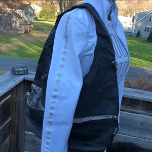 Black shoulder bag with many pockets inside